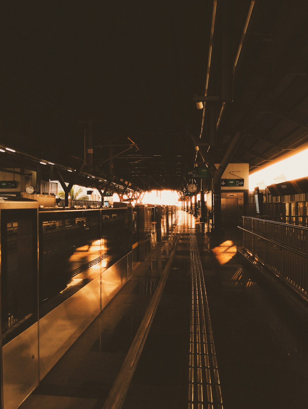 a train station with a train on the tracks