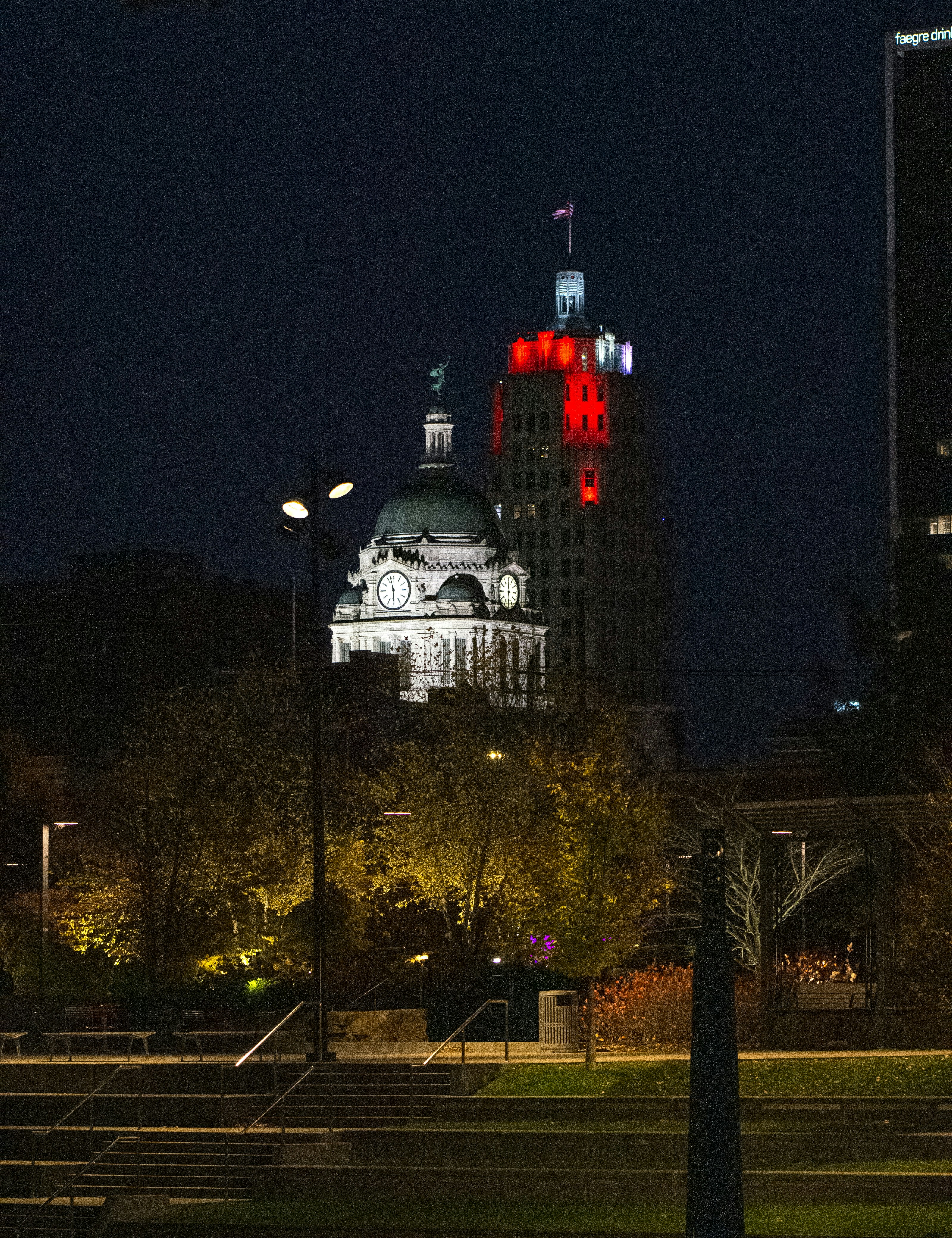 a building lit up in red and white at night