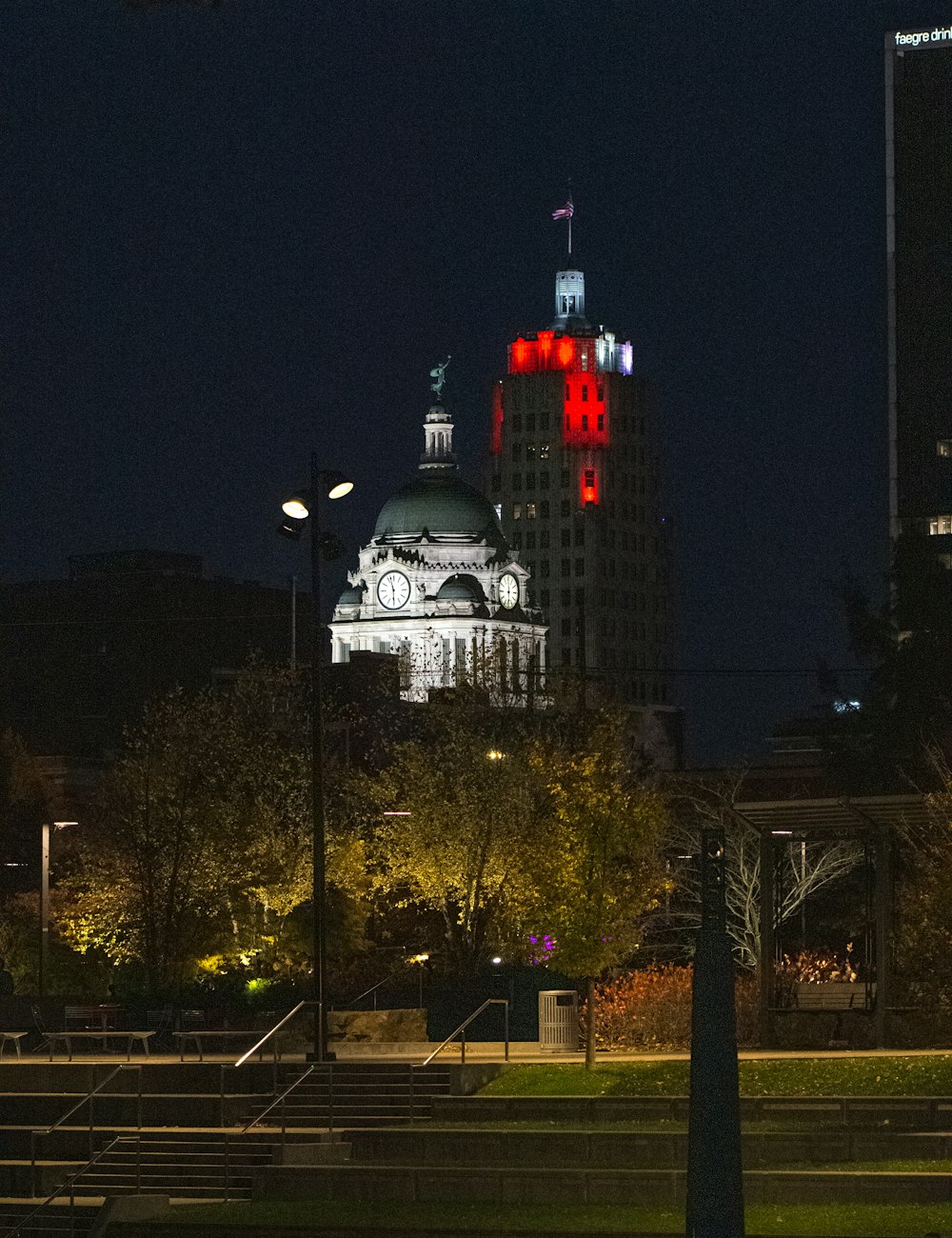 a building lit up in red and white at night