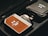 A close-up view of a device with a brown leather-like texture, branded 'Hobolite' and labeled with 'NFC' in a sleek, metallic case. The device is positioned next to a folded item with another 'Hobolite' label, all placed within a black fabric bag or case.