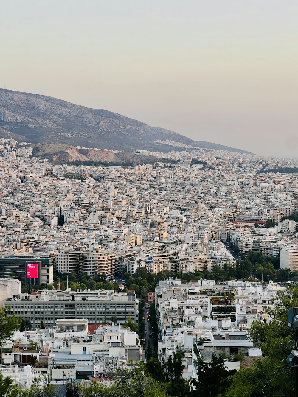 a view of a city with mountains in the background