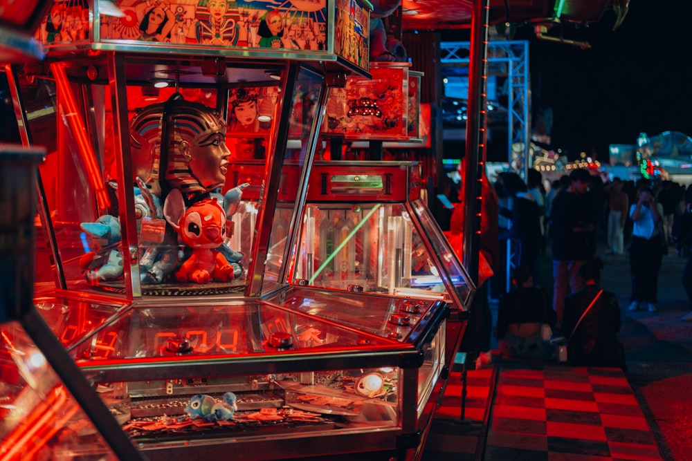 a pinball machine sitting on top of a checkered floor