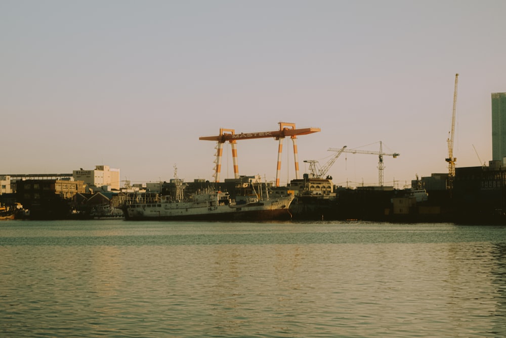 a body of water with a boat in the background