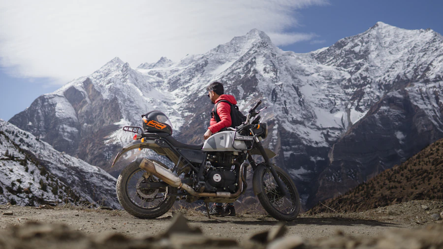 Rider sitting on a motorcycle overlooking a high-altitude Mustang landscape in Nepal