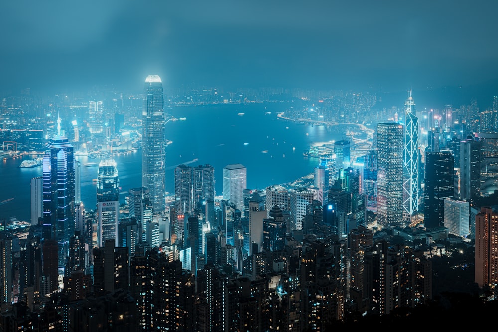 a view of a city at night from the top of a hill