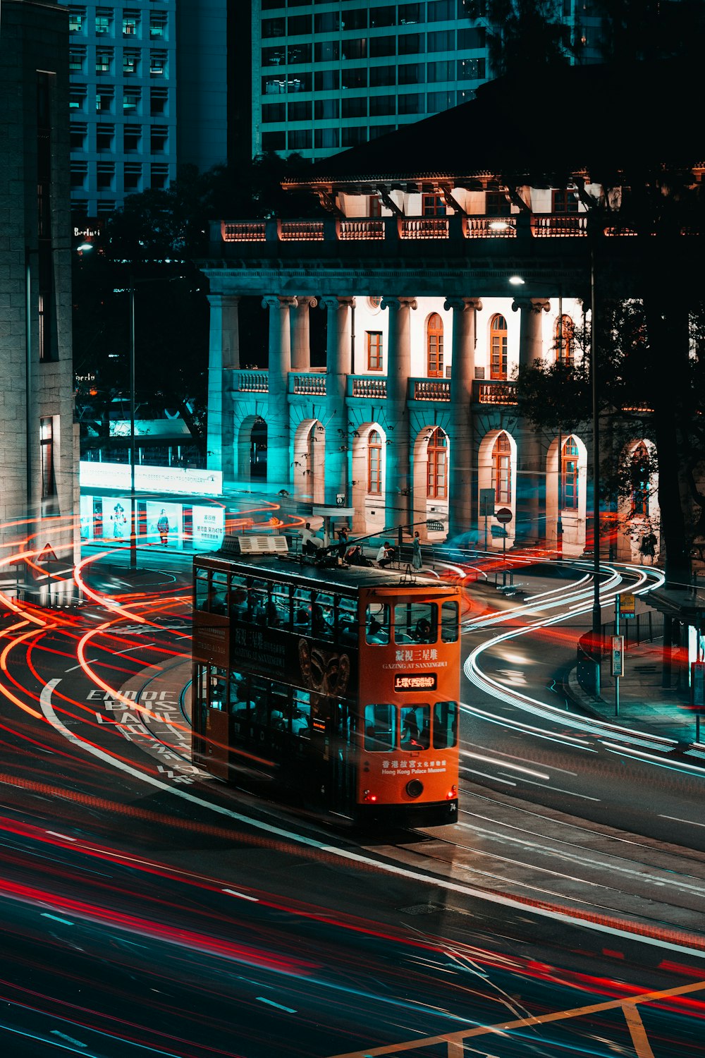 a double decker bus driving down a city street