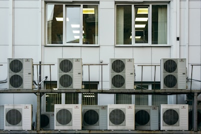 A modern air conditioning unit installed in a bright, eco-friendly office space.