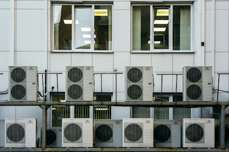 Technicians installing a modern HVAC system in a commercial building in Lucknow.