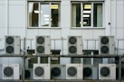 Close-up of a professional cleaning the internal components of an air conditioner