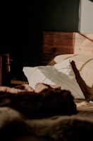 An inviting bedroom with soft textiles and warm lighting.