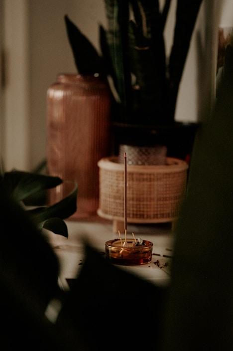 A serene setting with incense and tea products.