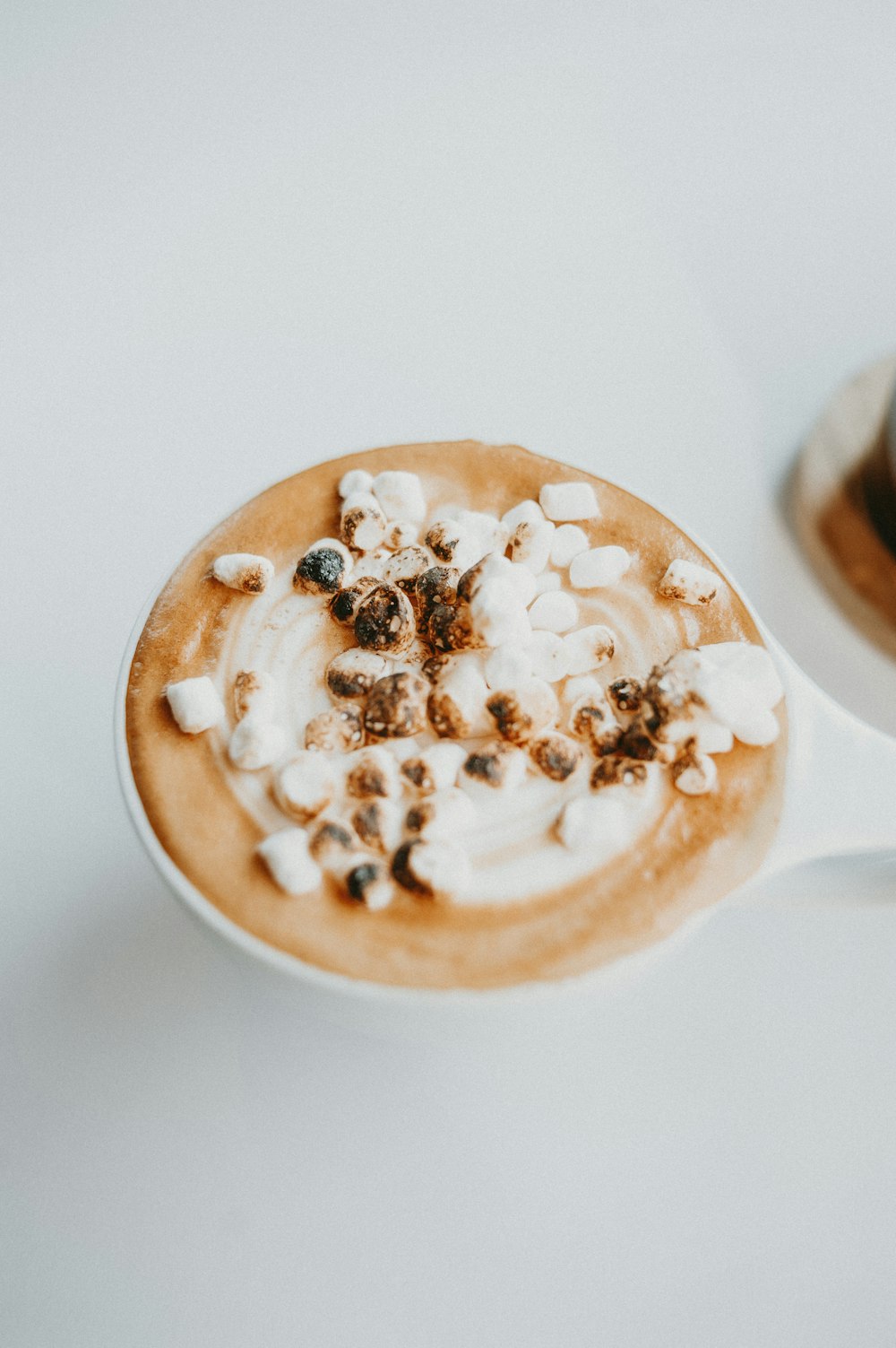 a cappuccino with marshmallows on top of it
