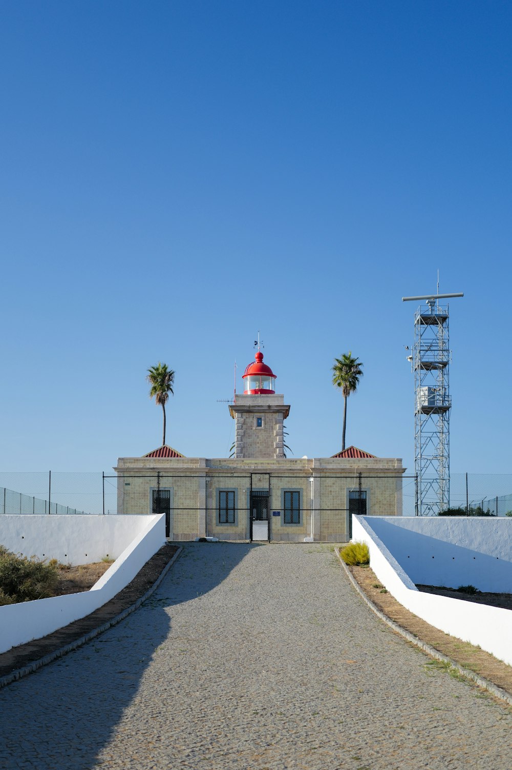 a small building with a red dome on top of it