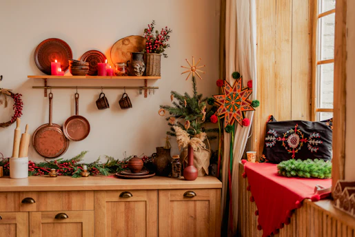 A cozy kitchen scene with warm orange tones, featuring a festive table set with traditional holiday dishes and seasonal decorations.