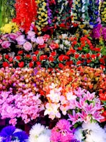 An elegant display of various artificial flower bouquets.