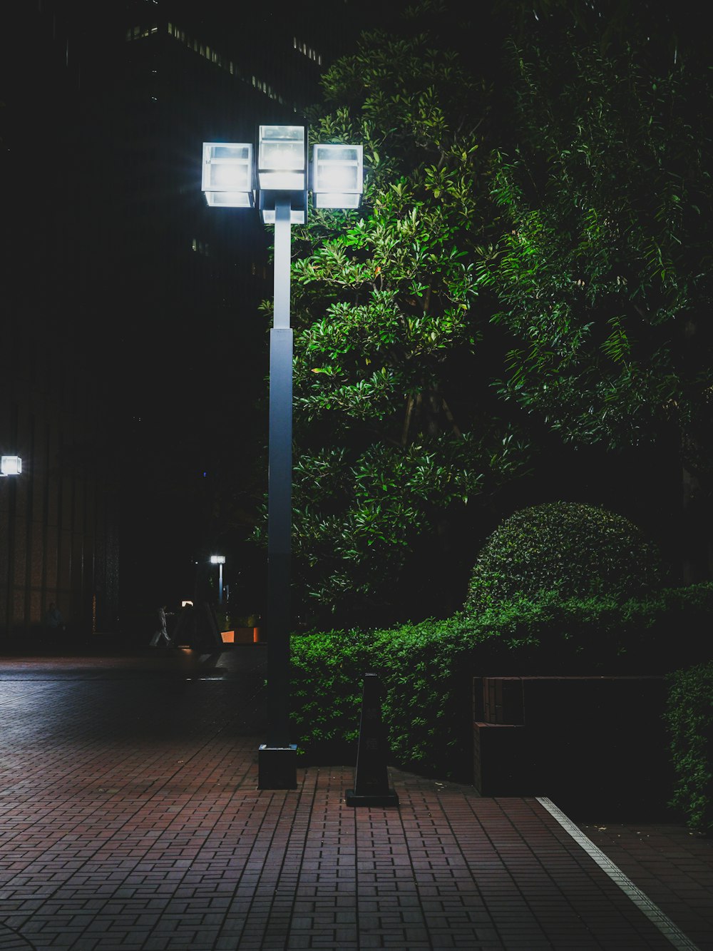 a street light sitting on the side of a road