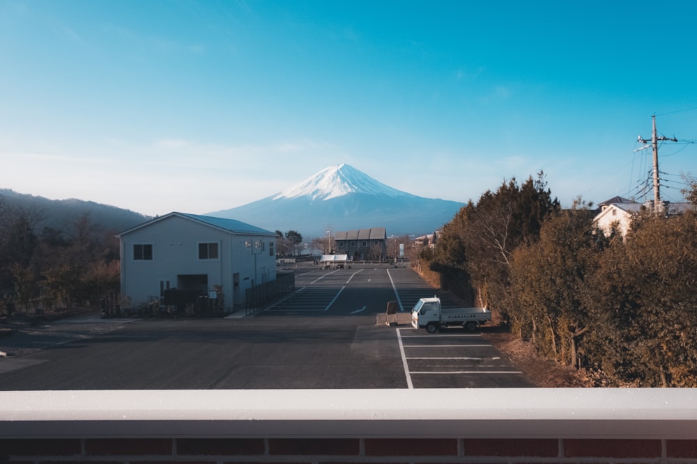 a parking lot with a mountain in the background