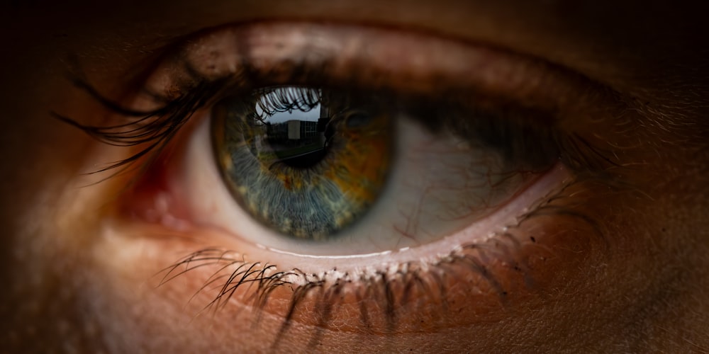 a close up of a person's blue eye