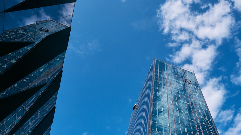 a couple of tall buildings sitting next to each other