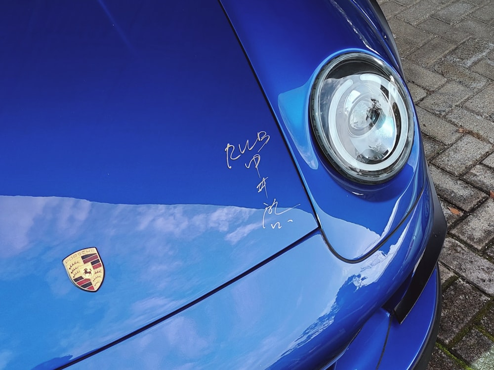 a close up of a blue sports car