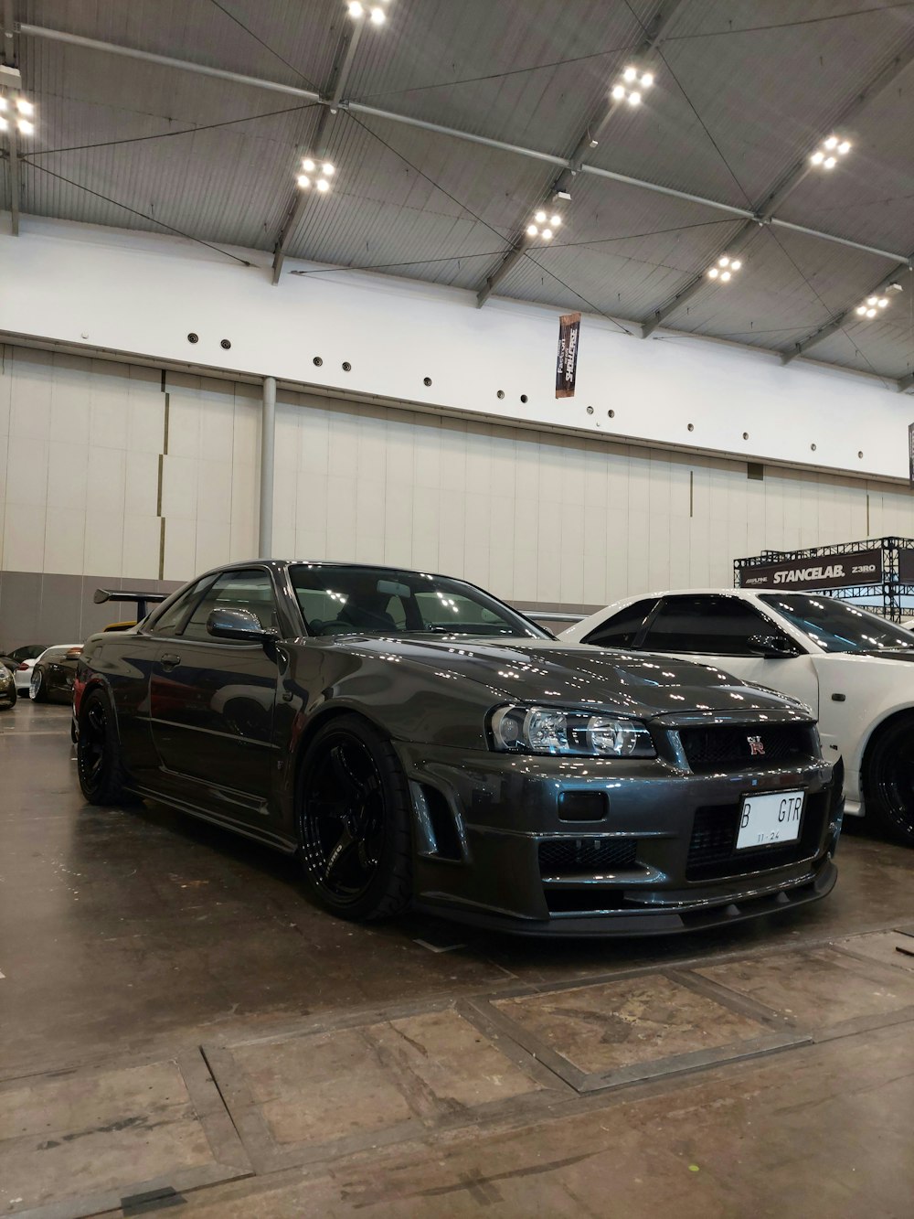 a couple of cars parked in a garage