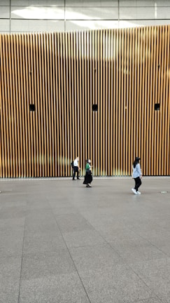 A sleek audio installation blending into a modern museum gallery wall.