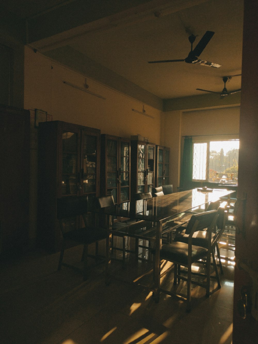 a room with a lot of chairs and a table