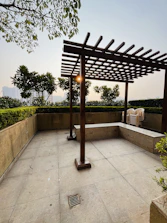 Modern pergola casting soft shadows over a stylish outdoor seating area.