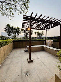 Modern pergola casting soft shadows over a stylish outdoor seating area.