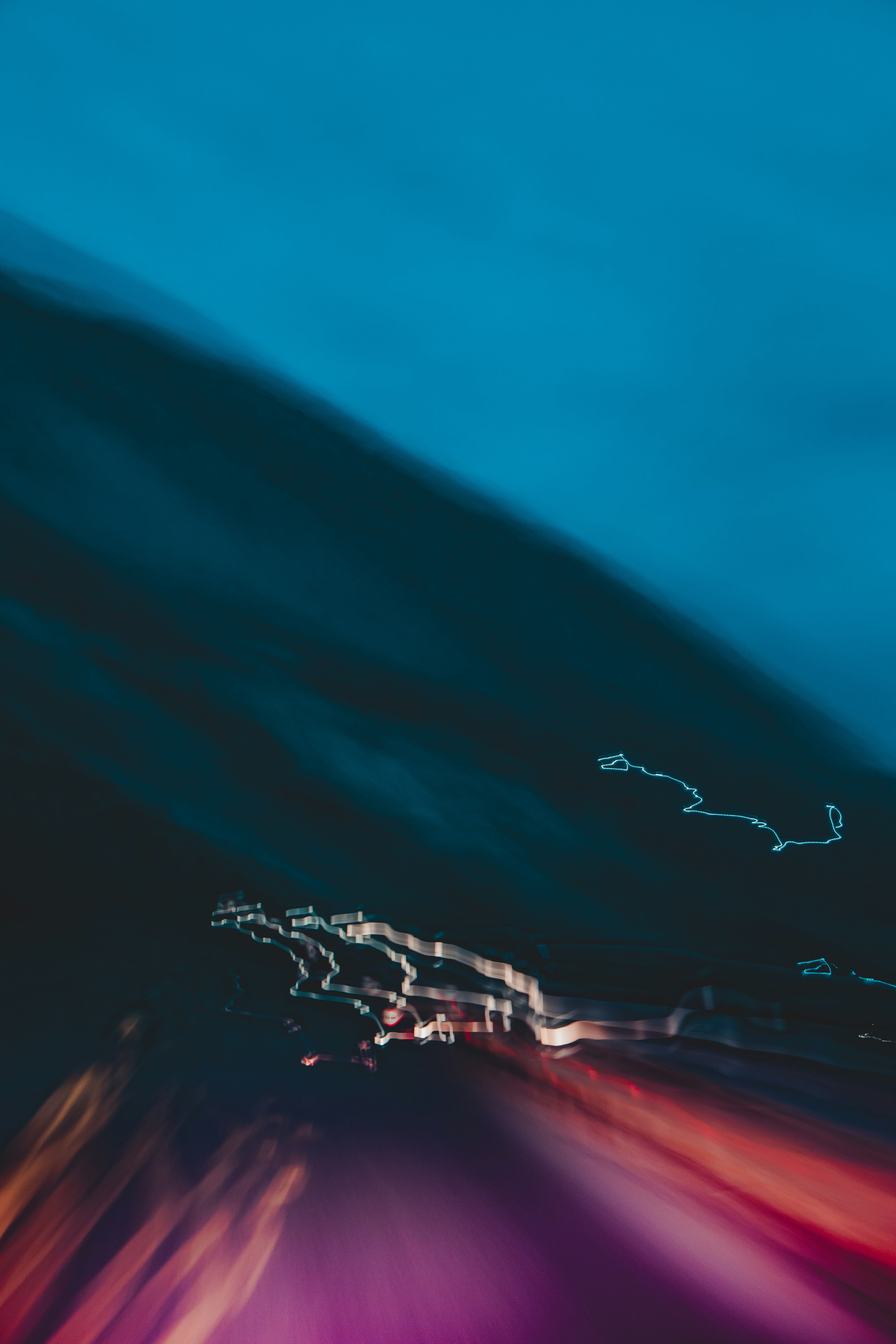 a blurry photo of a street at night