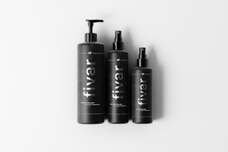 Three black bottles each with a dispenser pump or spray top, labeled with the brand name 'fivar'. They are arranged side by side on a plain white background.
