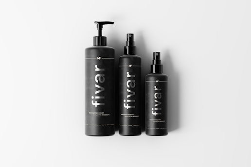 Three black bottles each with a dispenser pump or spray top, labeled with the brand name 'fivar'. They are arranged side by side on a plain white background.