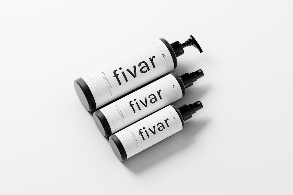 three tubes of fivar on a white surface