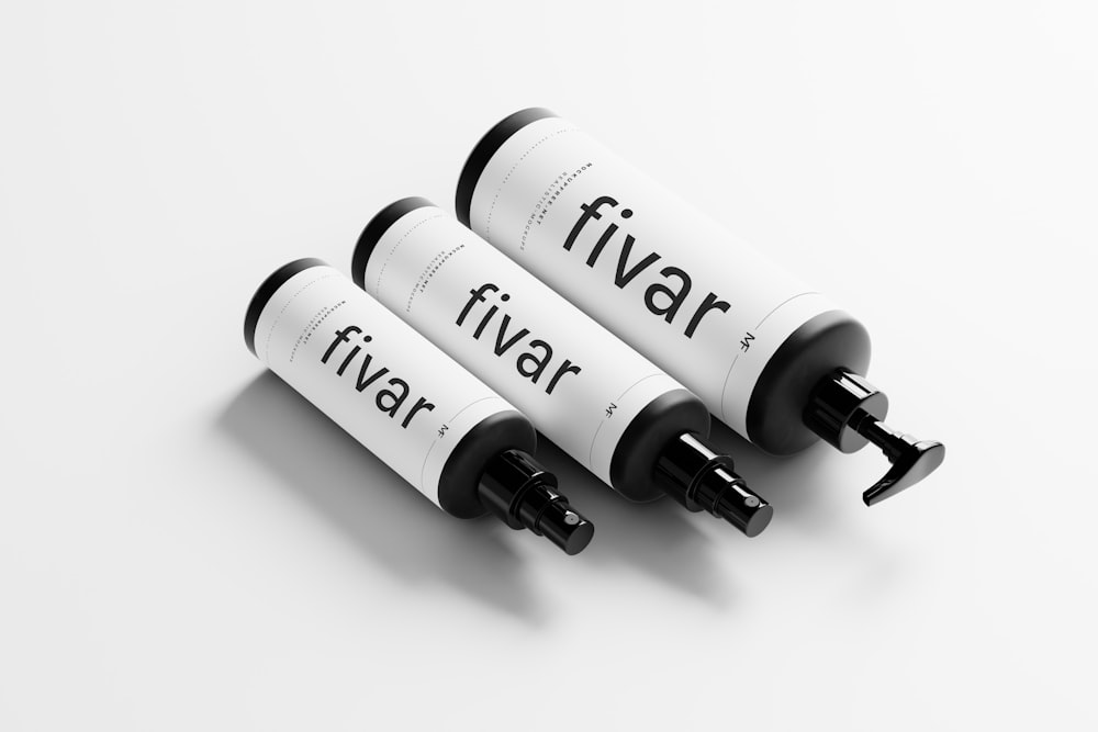 three black and white tubes with the words fivar on them