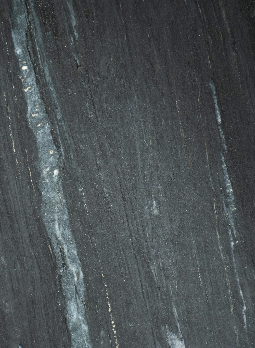 a close up of a black marble surface