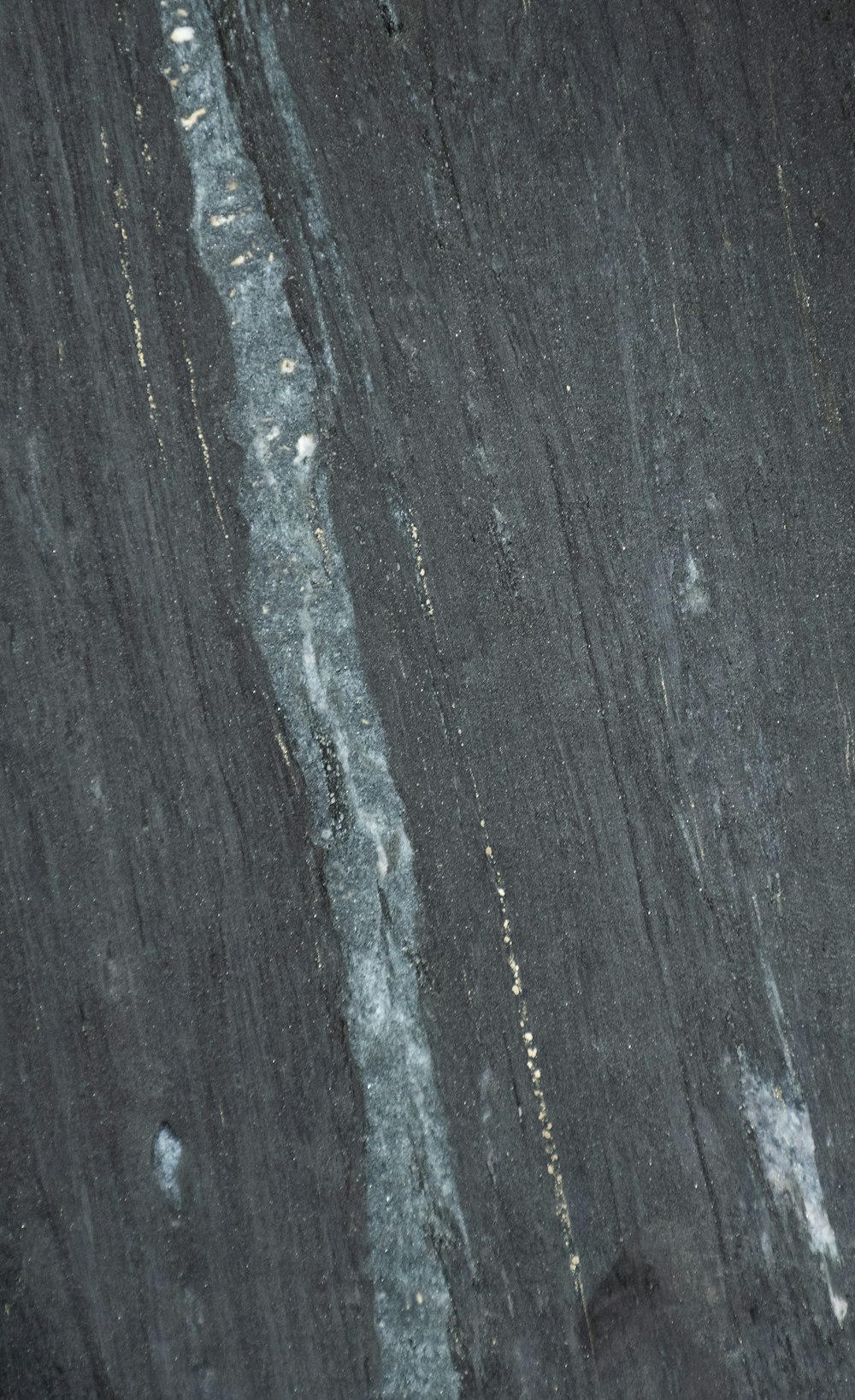 a close up of a black marble surface