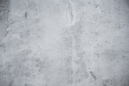 a black and white photo of a concrete wall