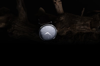 An elegant watch displayed against a minimalist background.