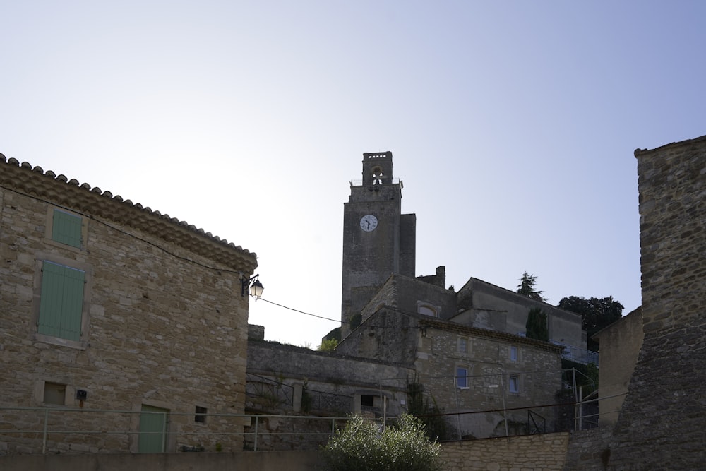 an old building with a clock tower in the background