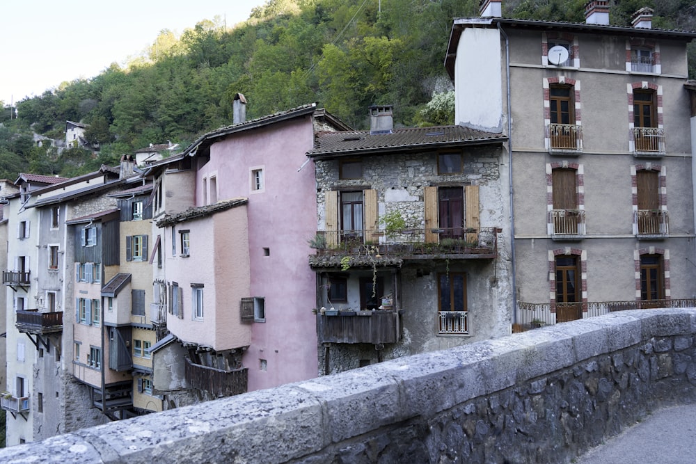 a group of buildings sitting on the side of a road