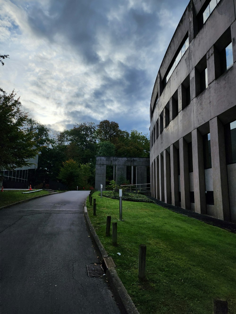 a large building sitting on the side of a road