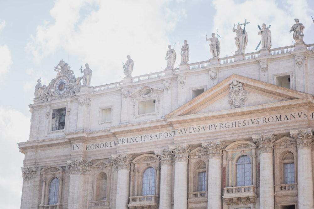 a large building with statues on top of it