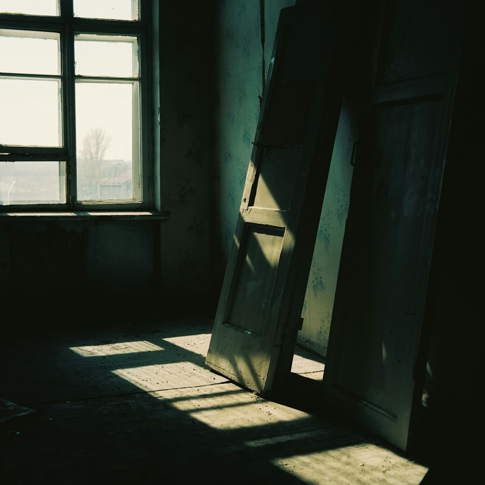 a ladder leaning against a wall next to a window