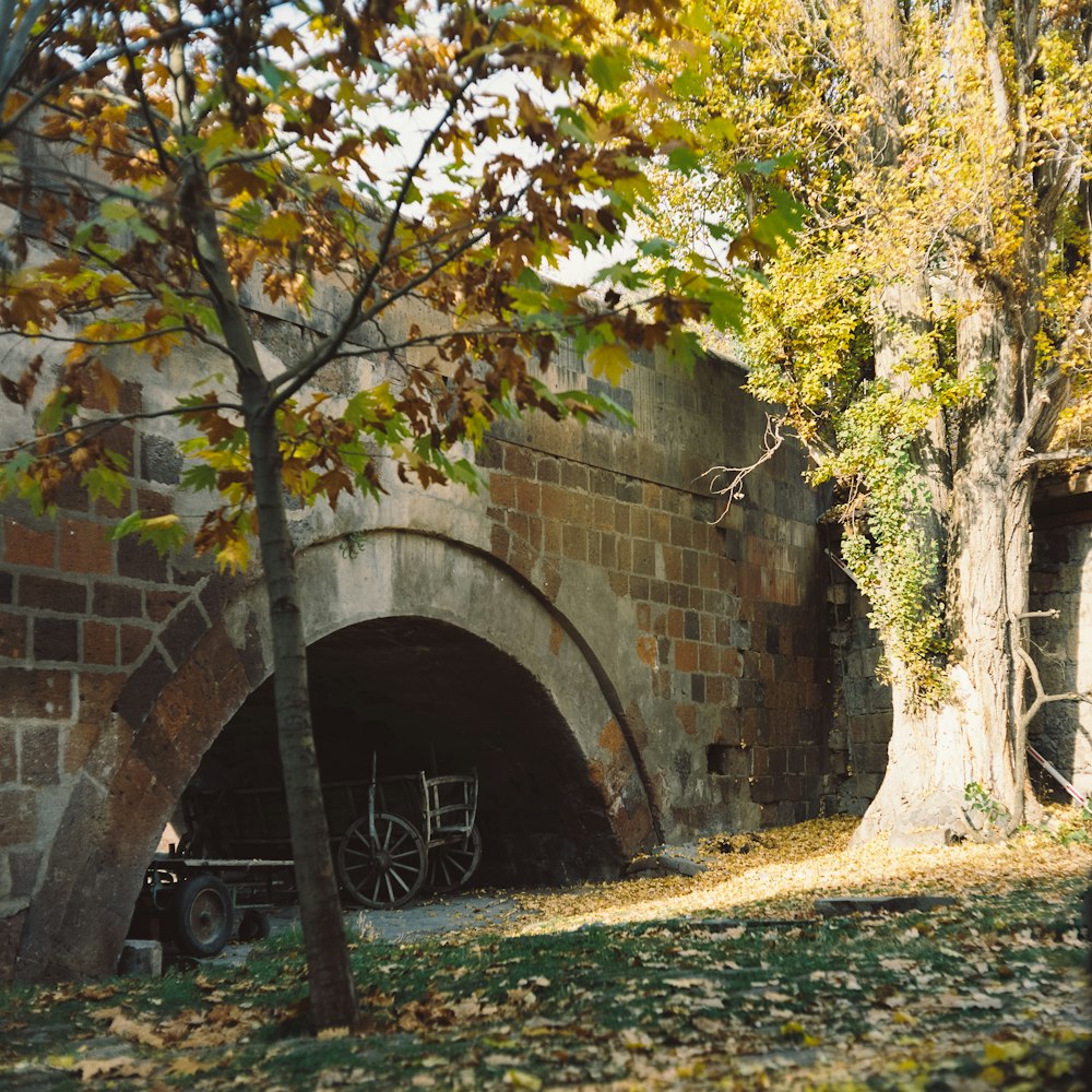 an old brick tunnel with a wagon in it