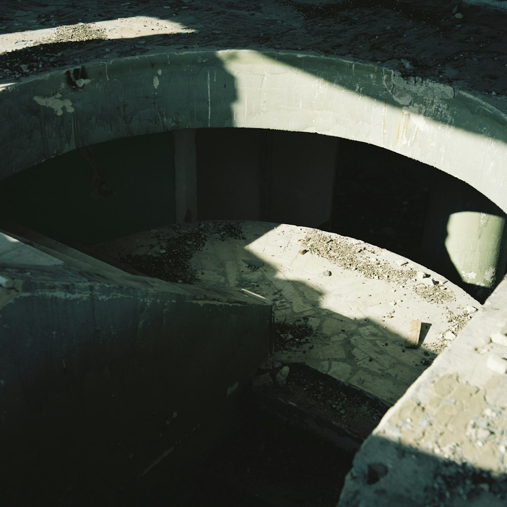 a concrete structure with a cement wall and a cement floor