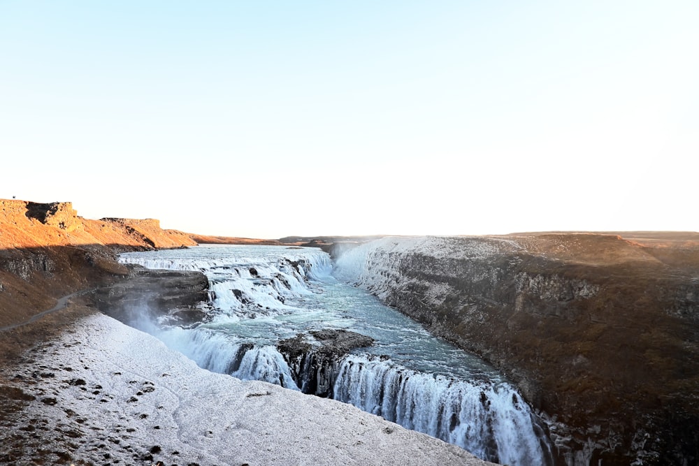 a large waterfall in the middle of a desert