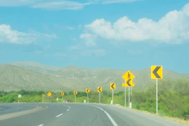 Illustration of colorful traffic signs with simple labels and explanations.