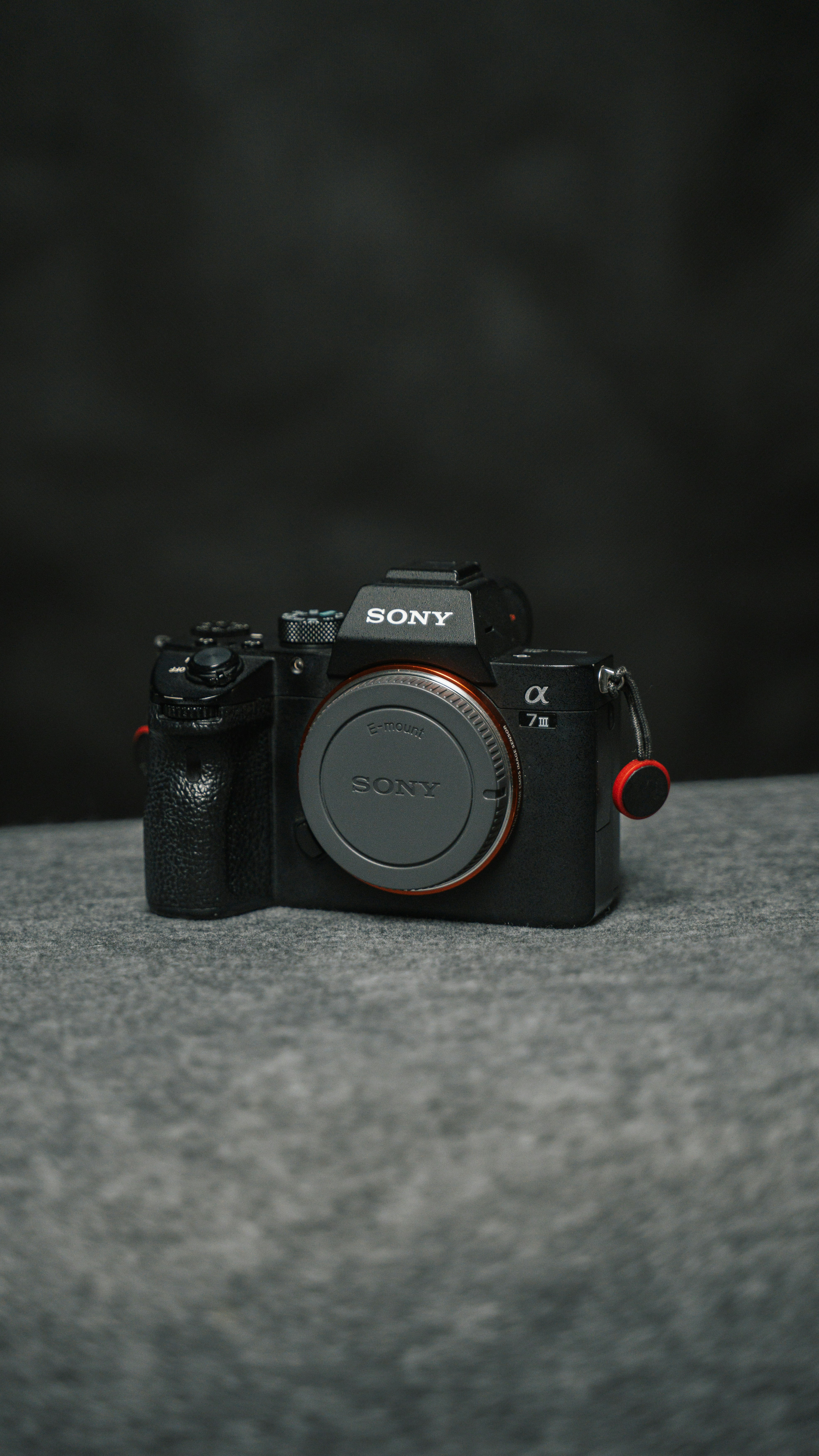 a black camera sitting on top of a table