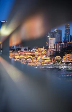 A cinematic frame showing a dramatic urban night scene with vibrant lighting.