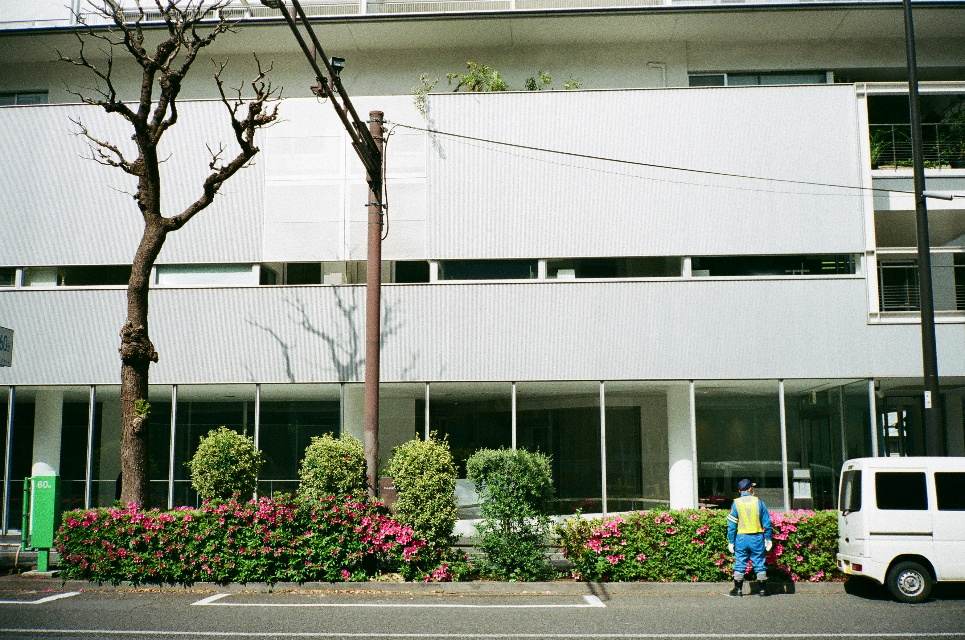 a couple of people that are standing in front of a building